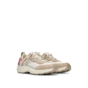 Mixed-material trainers with decorative reflective effects