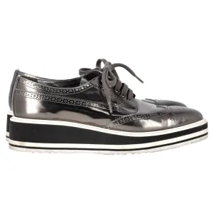 Prada Metallic Brogue Platform Low Top Sneakers in Silver Leather